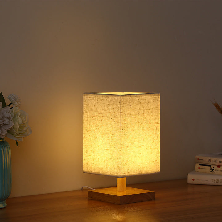 Kompakte skandinavische Holzfuß Tischlampe mit Leinenlampenschirm