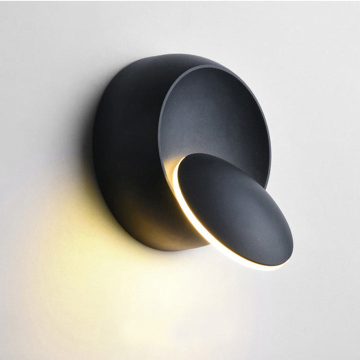 Zeitgenössische nordische Eisenrunde Eclipse drehbare LED-Wandleuchte für Nachttisch