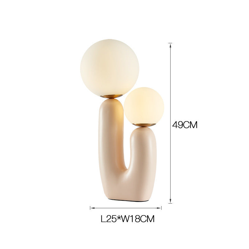 Künstlerische Tischlampe mit dualem Globusdesign