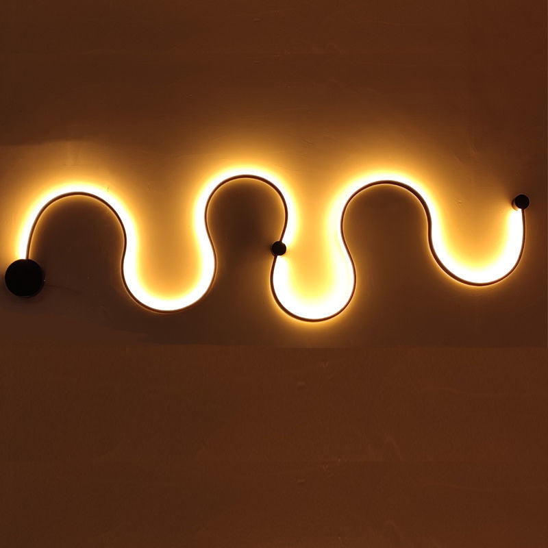 Skulpturale LED Wellenwandlampe